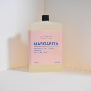 Handcrafted Margarita cocktail in a 275ml bottle, gift-wrapped with fresh garnishes, ready to drink