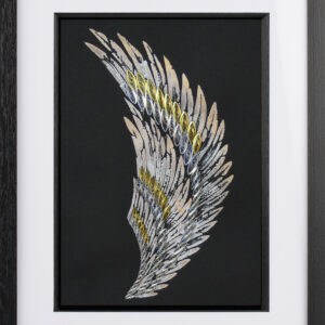 A gold and silver, paper quilled, angel wing on a black background.