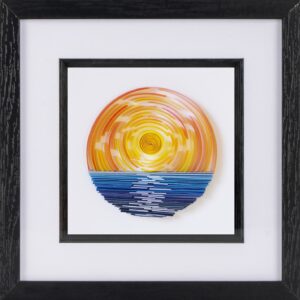 A paper quilled orange sunset above a blue sea.